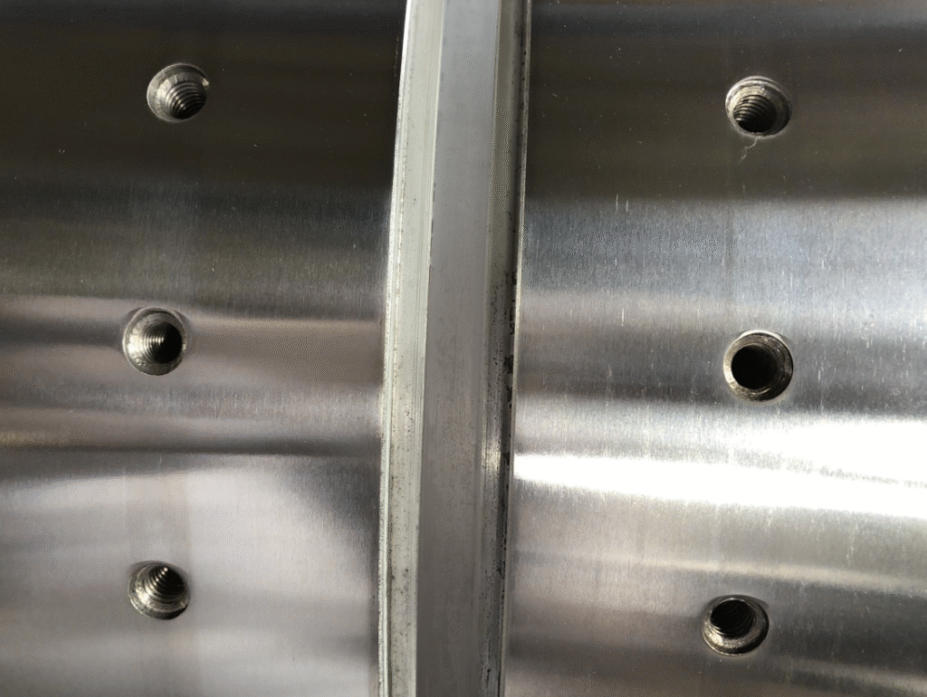mounting cylinder with slots